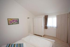 Postel nebo postele na pokoji v ubytování Residence Mama