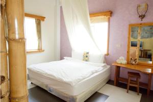 Giường trong phòng chung tại Xian Qing Yu Zhi Homestay