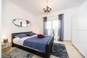 a bedroom with a bed and a mirror at Little Dream in Poljana +43 photos