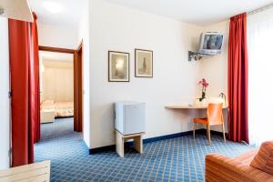 TV a/nebo společenská místnost v ubytování Hotel San Vito