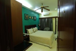 Ένα ή περισσότερα κρεβάτια σε δωμάτιο στο Golden Orchid - Kolkata