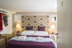 A bed or beds in a room at RossoCorallo B&B