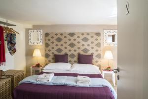 Posteľ alebo postele v izbe v ubytovaní RossoCorallo B&B