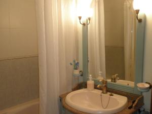 a bathroom with a sink and a mirror and a tub at Sierras y Valles in Salvatierra de los Barros +109 photos