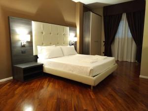 Posteľ alebo postele v izbe v ubytovaní Brain Rooms & Suite