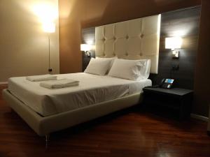Posteľ alebo postele v izbe v ubytovaní Brain Rooms & Suite