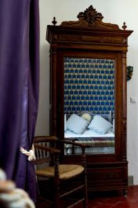 Postel nebo postele na pokoji v ubytování La Maison des Palmiers