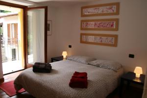 En eller flere senge i et værelse på Casa del Gelsomino