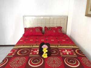 Postel nebo postele na pokoji v ubytování Indekost Bogor