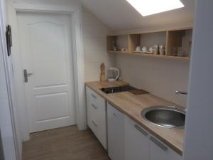 Kuchyň nebo kuchyňský kout v ubytování Apartment Mašić