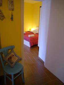 Postel nebo postele na pokoji v ubytování B&B La Muraglia