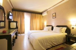 Postel nebo postele na pokoji v ubytování Diwane Hotel & Spa Marrakech