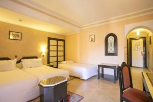 Postel nebo postele na pokoji v ubytování Diwane Hotel & Spa Marrakech