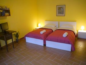 Postel nebo postele na pokoji v ubytování B&B La Muraglia