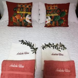 Giường trong phòng chung tại Guest House Antichi Ulivi