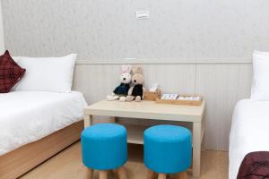 Postel nebo postele na pokoji v ubytování Four Seasons Homestay