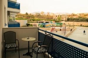 a balcony with a table and chairs and a playground at Luxury Apartment Marko in Split