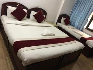 Postel nebo postele na pokoji v ubytování Hotel Lily