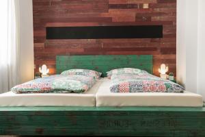 
Ein Bett oder Betten in einem Zimmer der Unterkunft Dippel Ferienwohnungen Ruhpolding
