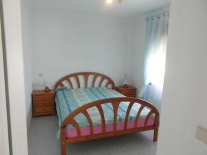 Postel nebo postele na pokoji v ubytování Apartamento con jardin