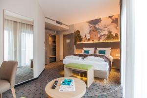 Postel nebo postele na pokoji v ubytování AKZENT Hotel Villa Saxer