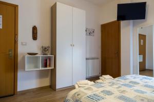 Postel nebo postele na pokoji v ubytování Albergo Felice
