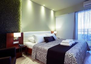 Postel nebo postele na pokoji v ubytování Eleftheria Hotel