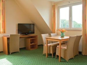 TV a/nebo společenská místnost v ubytování Berggasthof Hotel Igelwirt