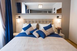 Postel nebo postele na pokoji v ubytování ANTARES Apart hotel