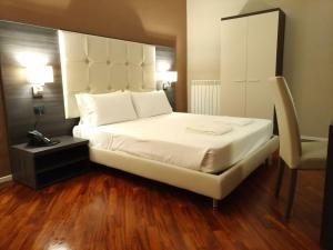 Posteľ alebo postele v izbe v ubytovaní Brain Rooms & Suite