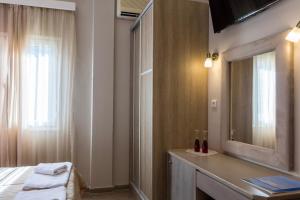 Postel nebo postele na pokoji v ubytování Apollon Hotel