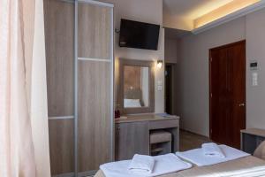 Postel nebo postele na pokoji v ubytování Apollon Hotel
