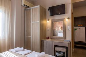 Postel nebo postele na pokoji v ubytování Apollon Hotel