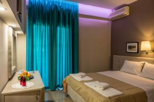 Postel nebo postele na pokoji v ubytování Apollon Hotel
