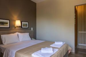 Postel nebo postele na pokoji v ubytování Apollon Hotel