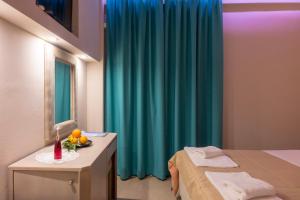 Postel nebo postele na pokoji v ubytování Apollon Hotel