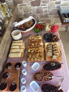 a table topped with lots of different types of food at Cunda Svila Otel - Adult Only in Ayvalık +33 photos