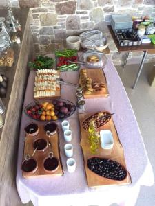 a table with many different types of food on it at Cunda Svila Otel - Adult Only in Ayvalık