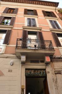 a building with a large window on the side of it at Rhona's Rooms in Rome