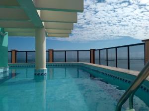 a swimming pool on top of a building at Hotel Brasil Tropical in Fortaleza