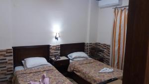 Postel nebo postele na pokoji v ubytování Ciao Hotel Cairo + 37 fotografií