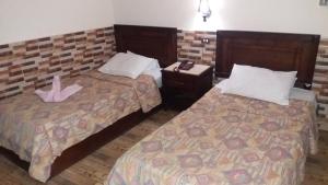 Postelja oz. postelje v sobi nastanitve Ciao Hotel Cairo