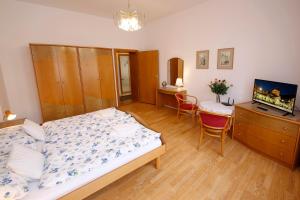 Postel nebo postele na pokoji v ubytování Apartman Moravska