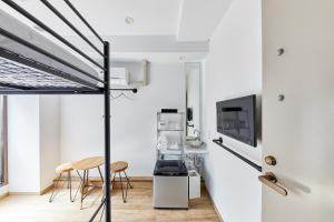 a room with white walls and a bed and chairs at Ya Do! KYOTO OKAZAKI in Kyoto