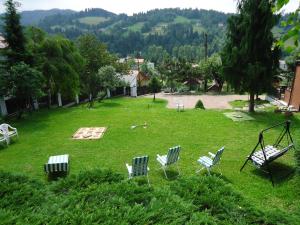 a group of chairs sitting in the grass at Na Markówce in Brenna