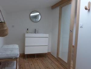 a bathroom with a sink and a mirror at Maison En Ville in Niort