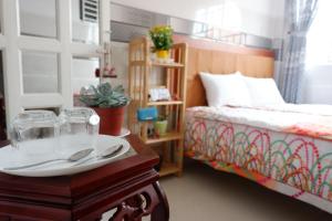 Tempat tidur dalam kamar di Thịnh's House