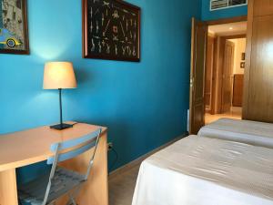 Posteľ alebo postele v izbe v ubytovaní Apartamentos Llobregat