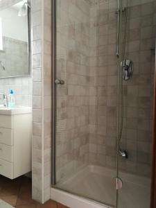 a shower with a glass door in a bathroom at Casa Vacanze Stefy in Pescantina +39 photos