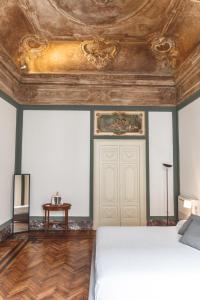 A bed or beds in a room at Relais Della Porta